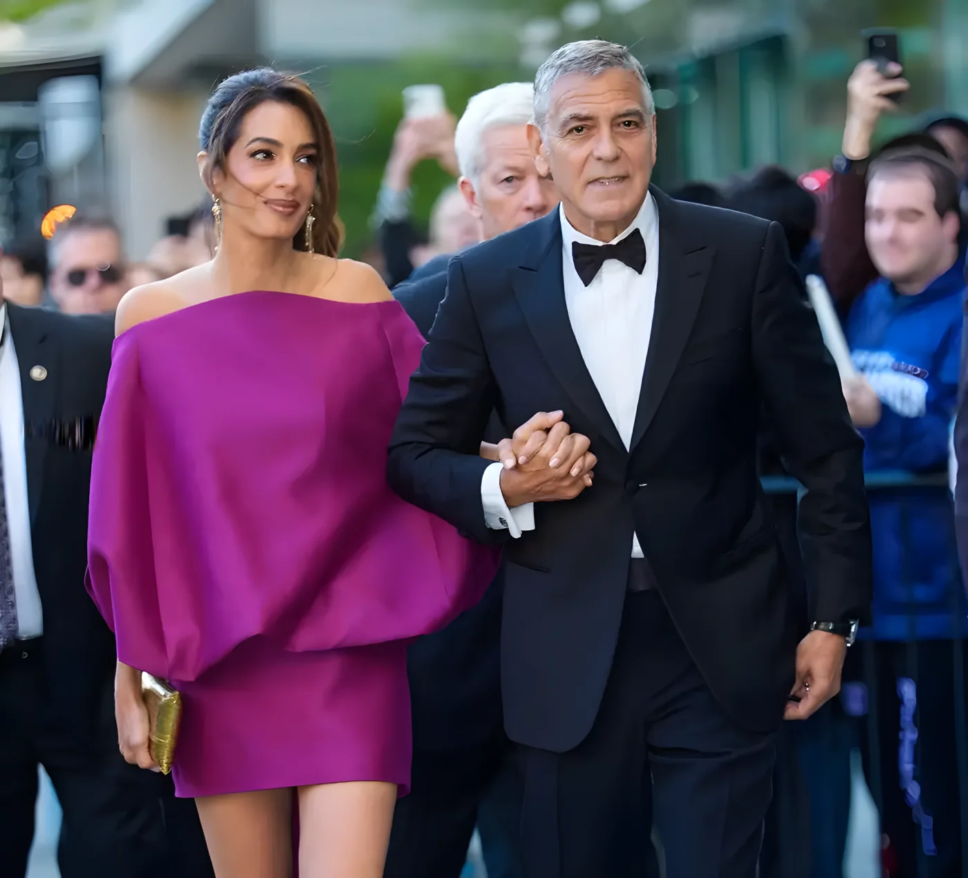 george amal clooney hand holding