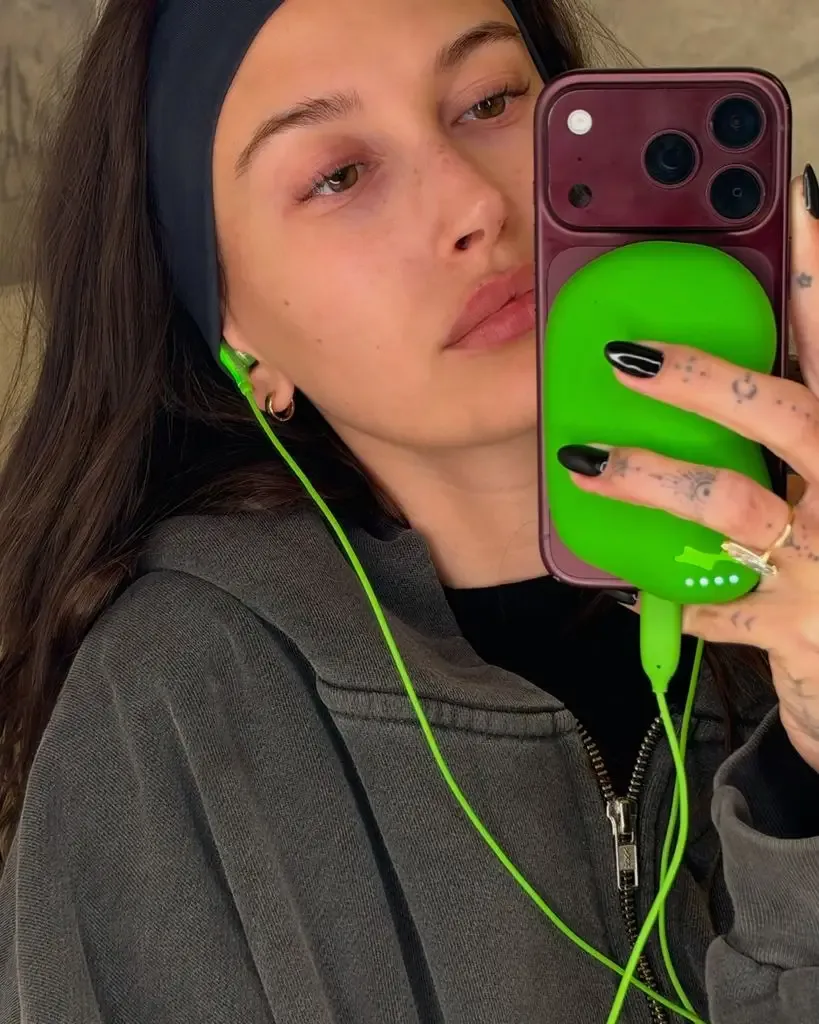 Hailey with green wired headphones