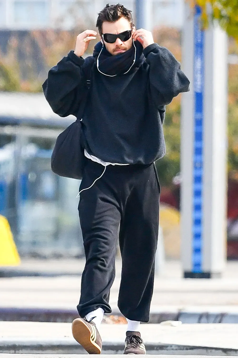 Harry Styles is spotted on a stroll in New York City. The British singer wore a black jacket,