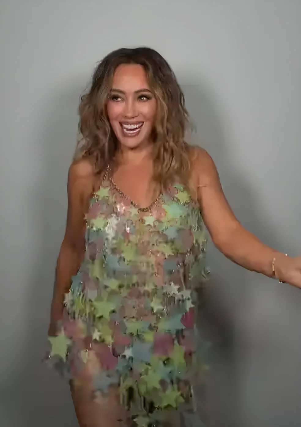 Hilary Duff wearing glow in the dark dress made of stars