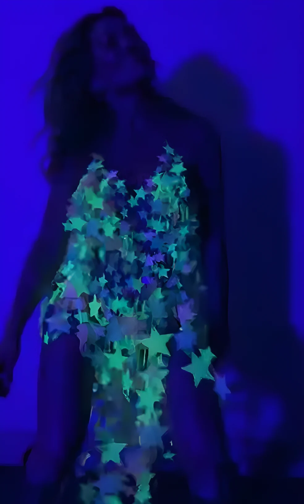 Hilary Duff wearing glow in the dark dress made of stars