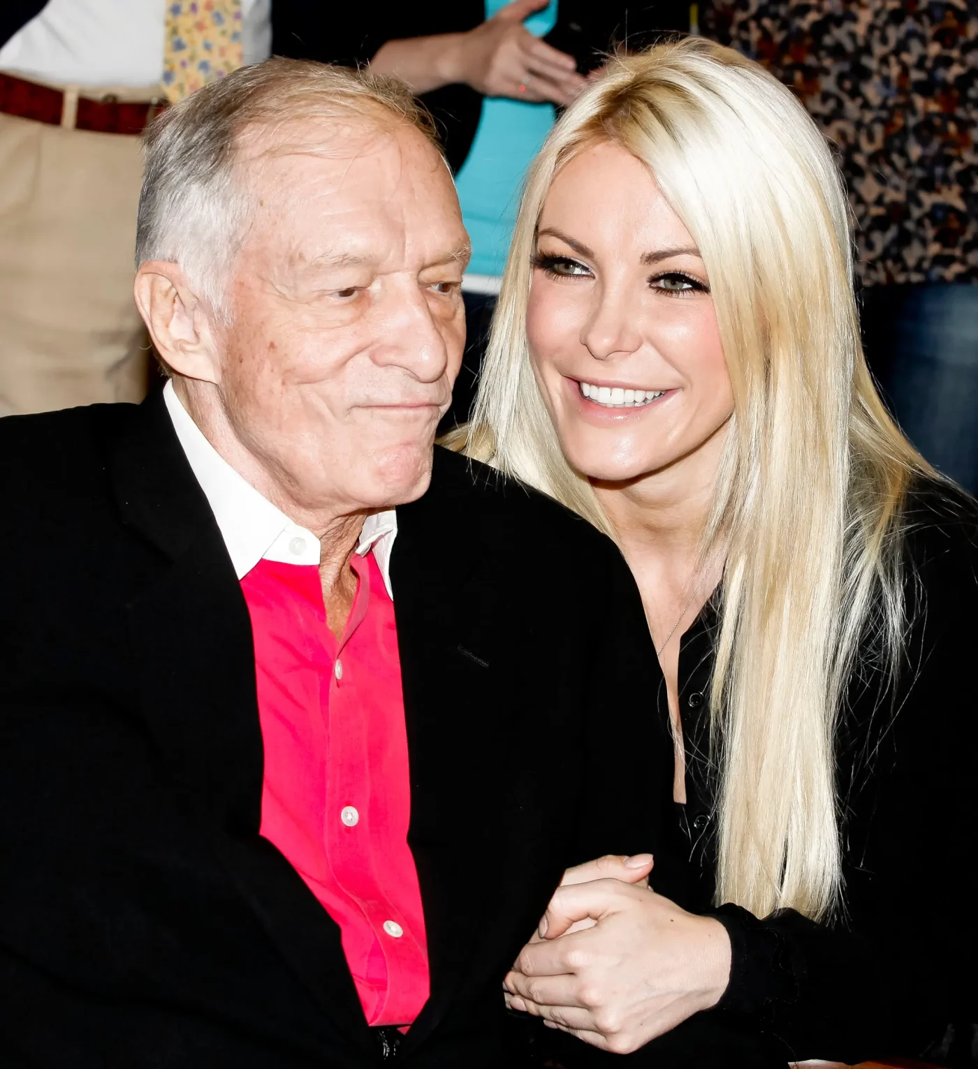 Hugh Hefner and Crystal Harris attend a ribbon-cutting ceremony.