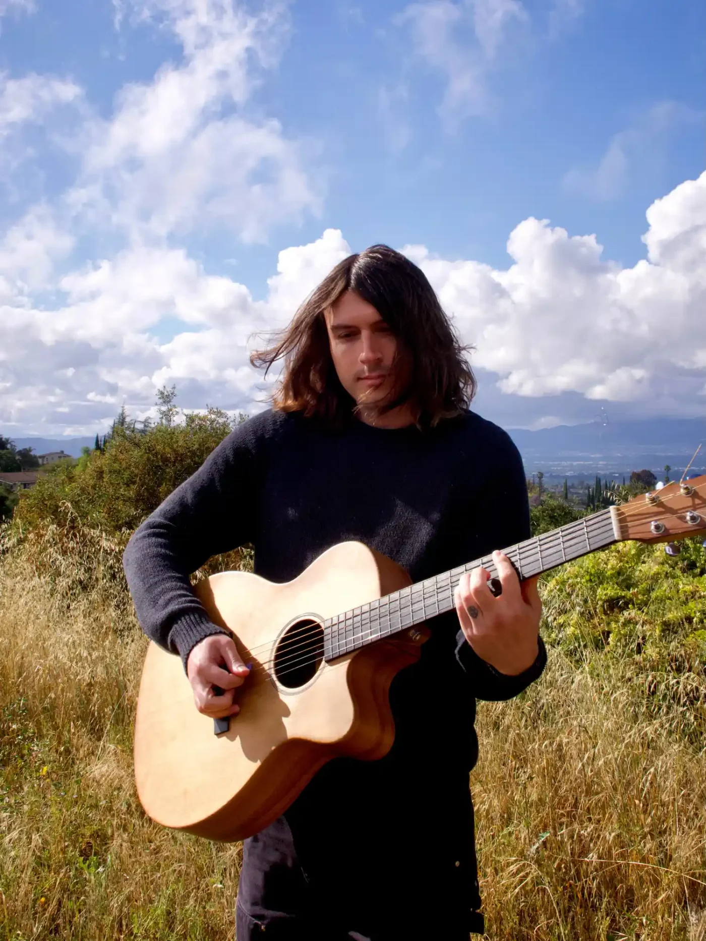 Indio Downey playing guitar