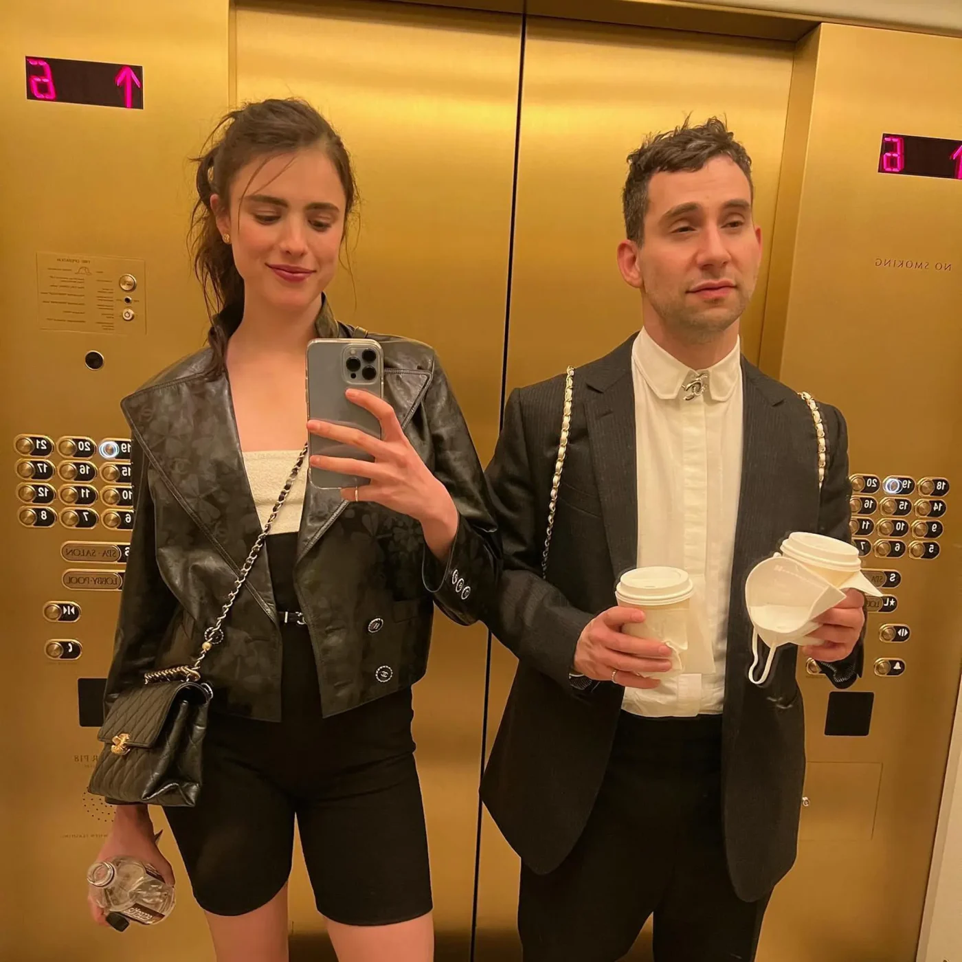 Jack Antonoff and Margaret Qualley take a selfie in an elevator.