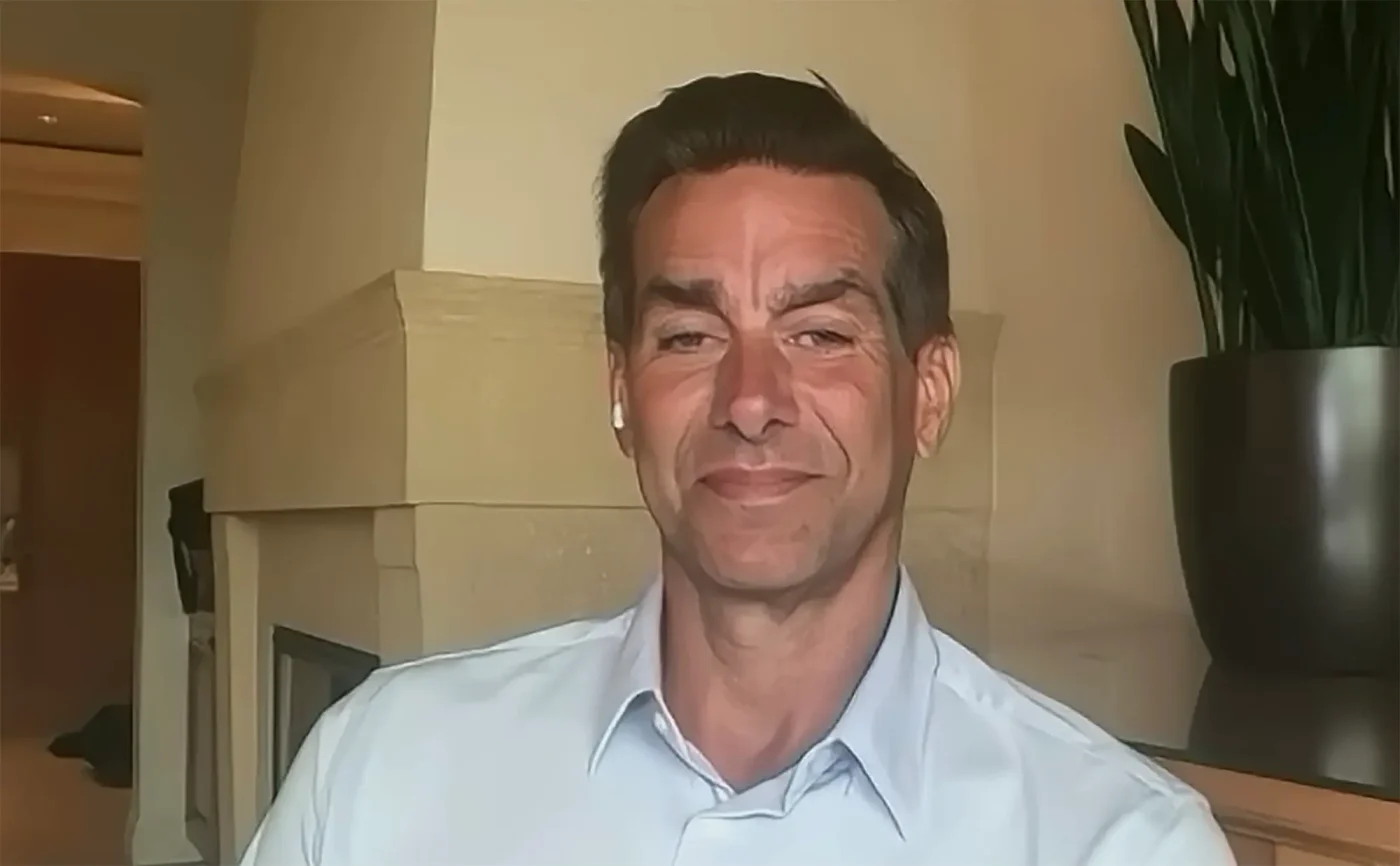 Jason Galanis in a light blue shirt.