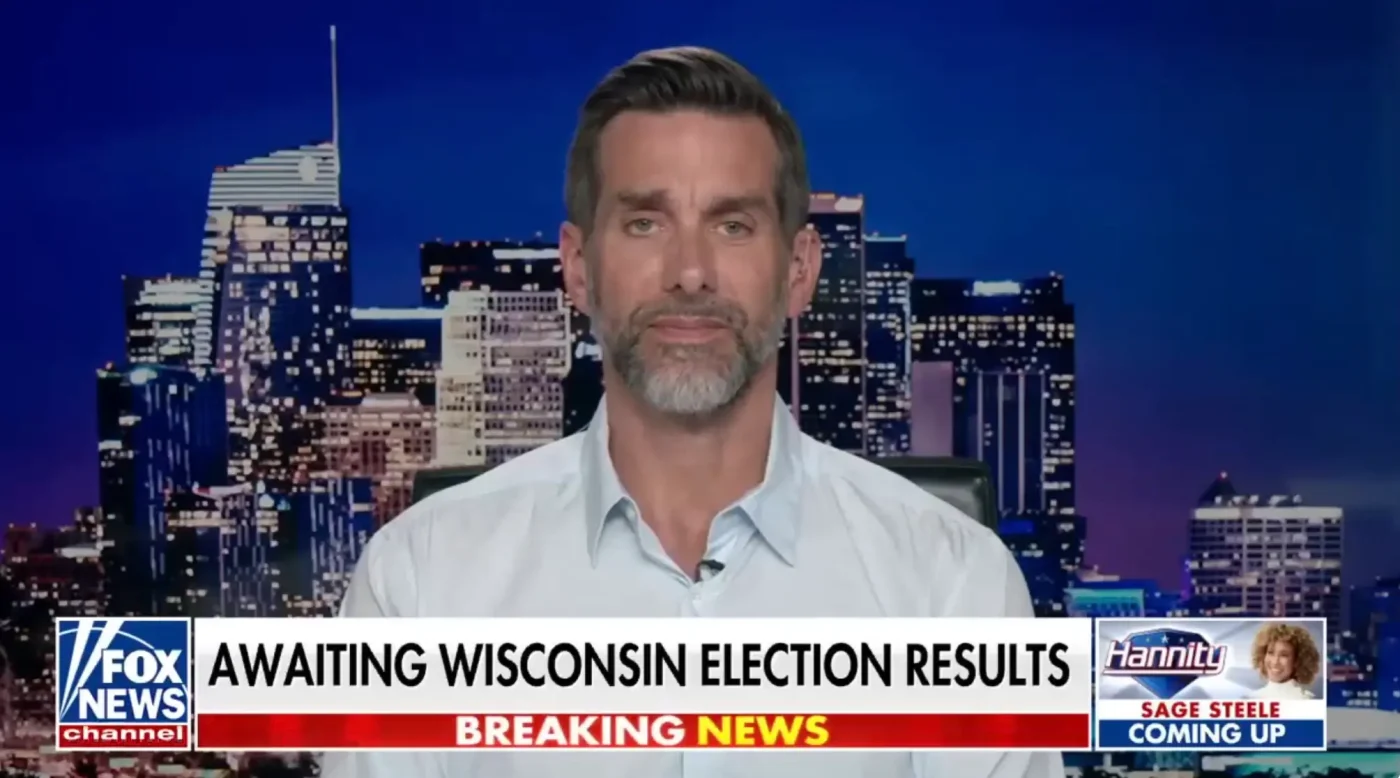 Jason Galanis speaking in an interview with a city skyline backdrop on Fox News.