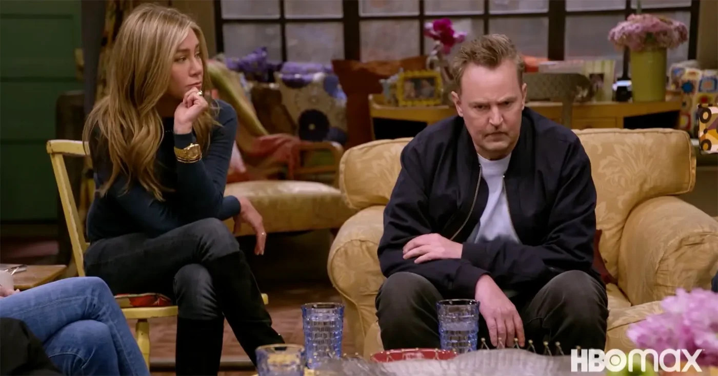 Jennifer Aniston and Matthew Perry sitting together during the Friends reunion.