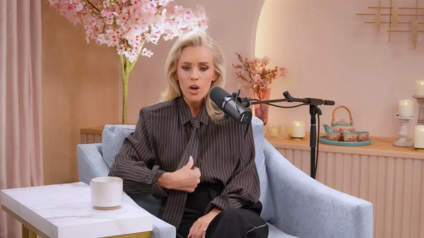 Jenny McCarthy sitting in an armchair in a podcast studio.