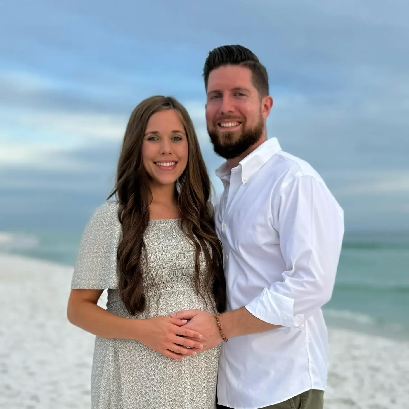 Jessa Duggar and Ben Seewald pose together on a beach.