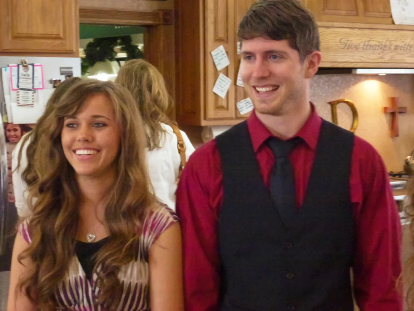 Jessa Duggar and Ben Seewald smiling indoors.