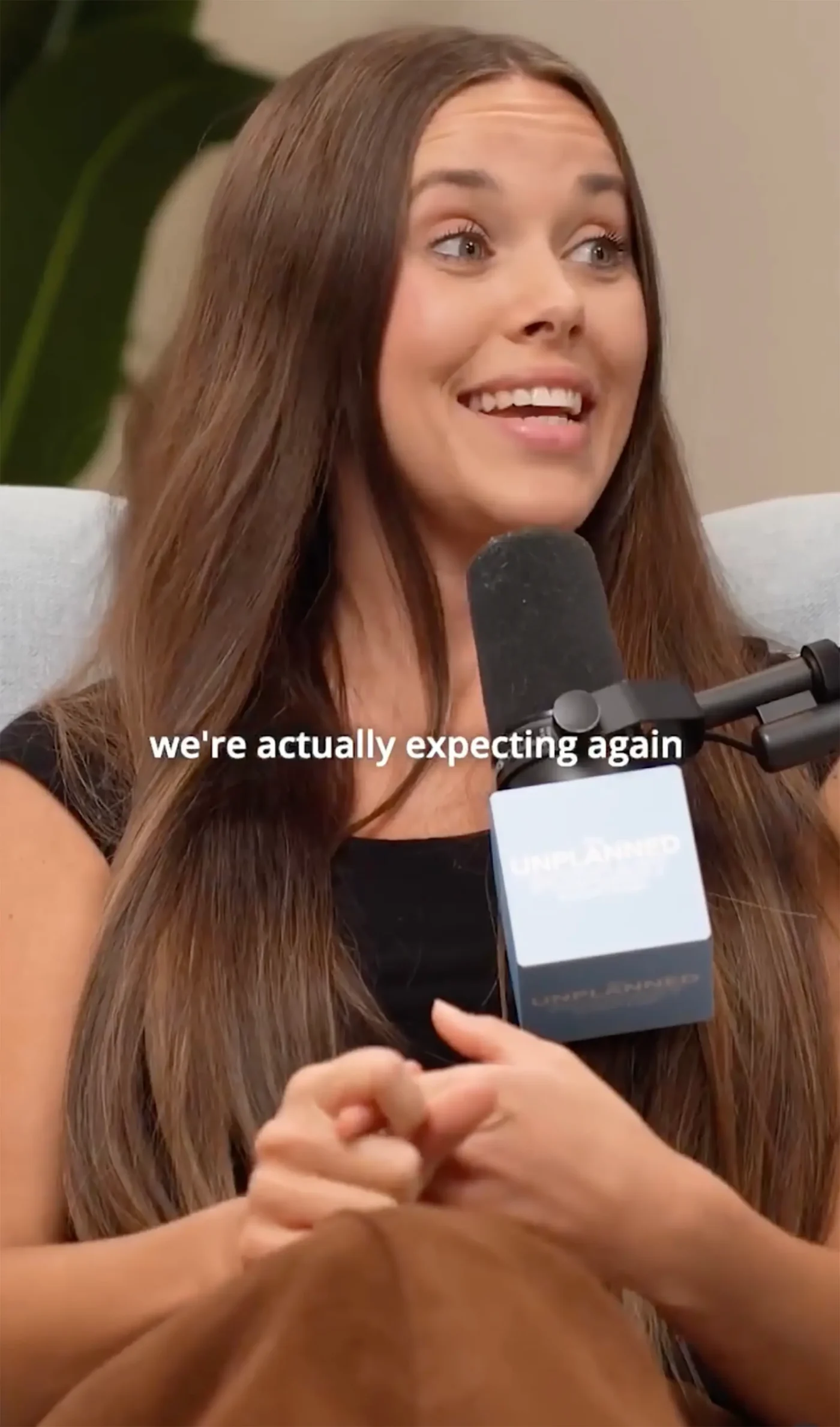 Jessa Duggar speaking into a podcast microphone with the caption "we