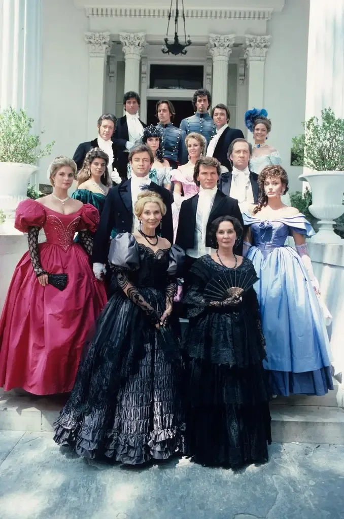 Jim Metzler (as James Huntoon), William Ostrander (as Forbes LaMotte), John Stockwell (as Billy Hazard), Lewis Smith (as Charles Main), Jonathan Frakes (as Stanley Hazard), Wendy Fulton (as Isabel Truscott Hazard); second row: Kirstie Alley (as Virgilia Hazard); Terri Garber (as Ashton Main Huntoon), Genie Francis (as Brett Main Hazard), David Carradine (as Justin LaMotte); third row: Wendy Kilbourne (as Constance Flynn Hazard), James Read (as George Hazard), Patrick Swayze (as Orry Main), Lesley-Anne Down (as Madeline Fabray LaMotte); bottom row: Inga Swenson (as Maude Hazard), Jean Simmons (as Clarissa Main) in North and South