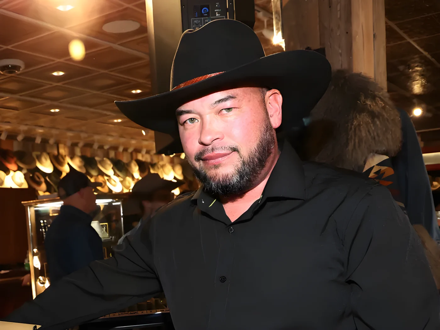 Jon Gosselin in a black cowboy hat and black shirt
