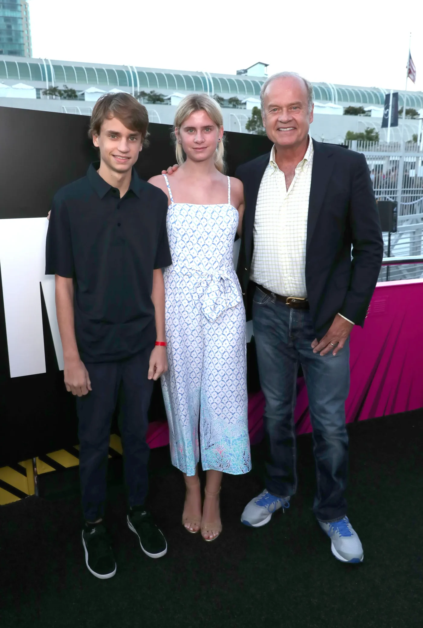 Jude Gordon Grammer, Mason Olivia Grammer, and Kelsey Grammer pose together outdoors.