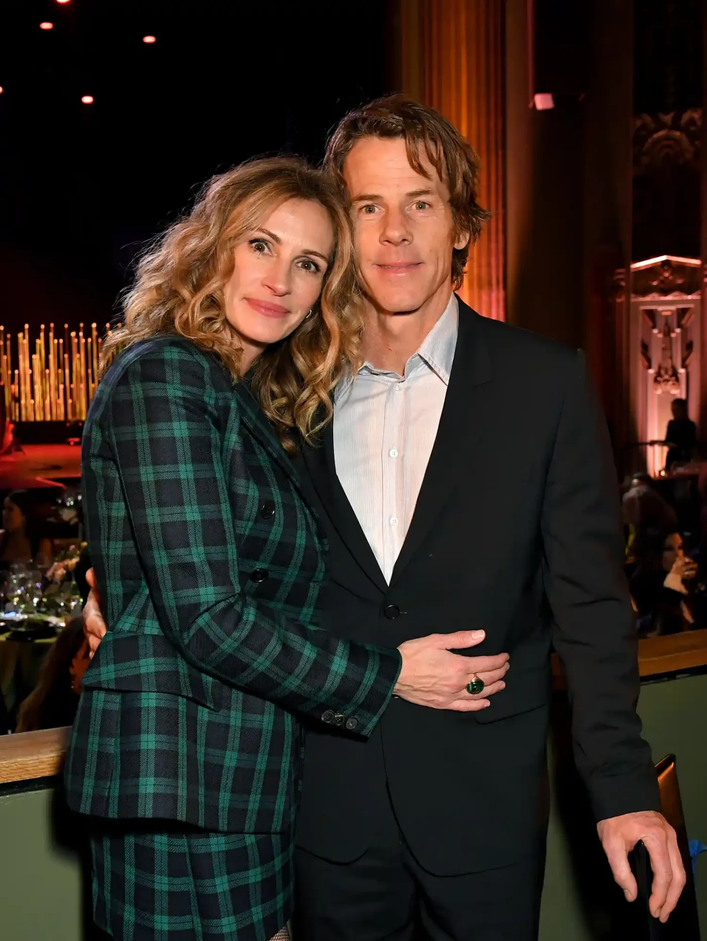 Julia Roberts with her husband Danny Moder in a dress and suit at event