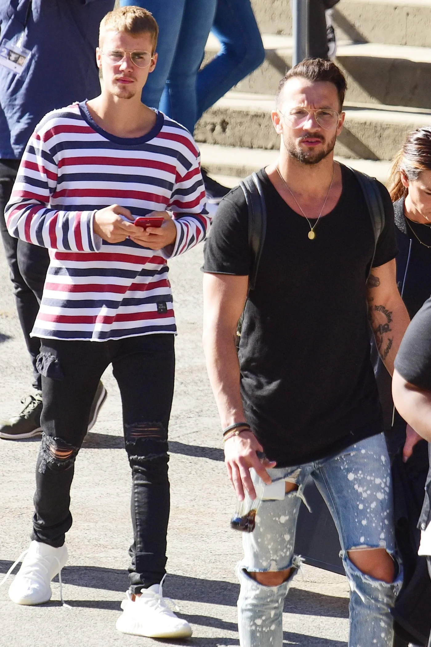 Justin Bieber and Pastor Carl Lentz walk together.