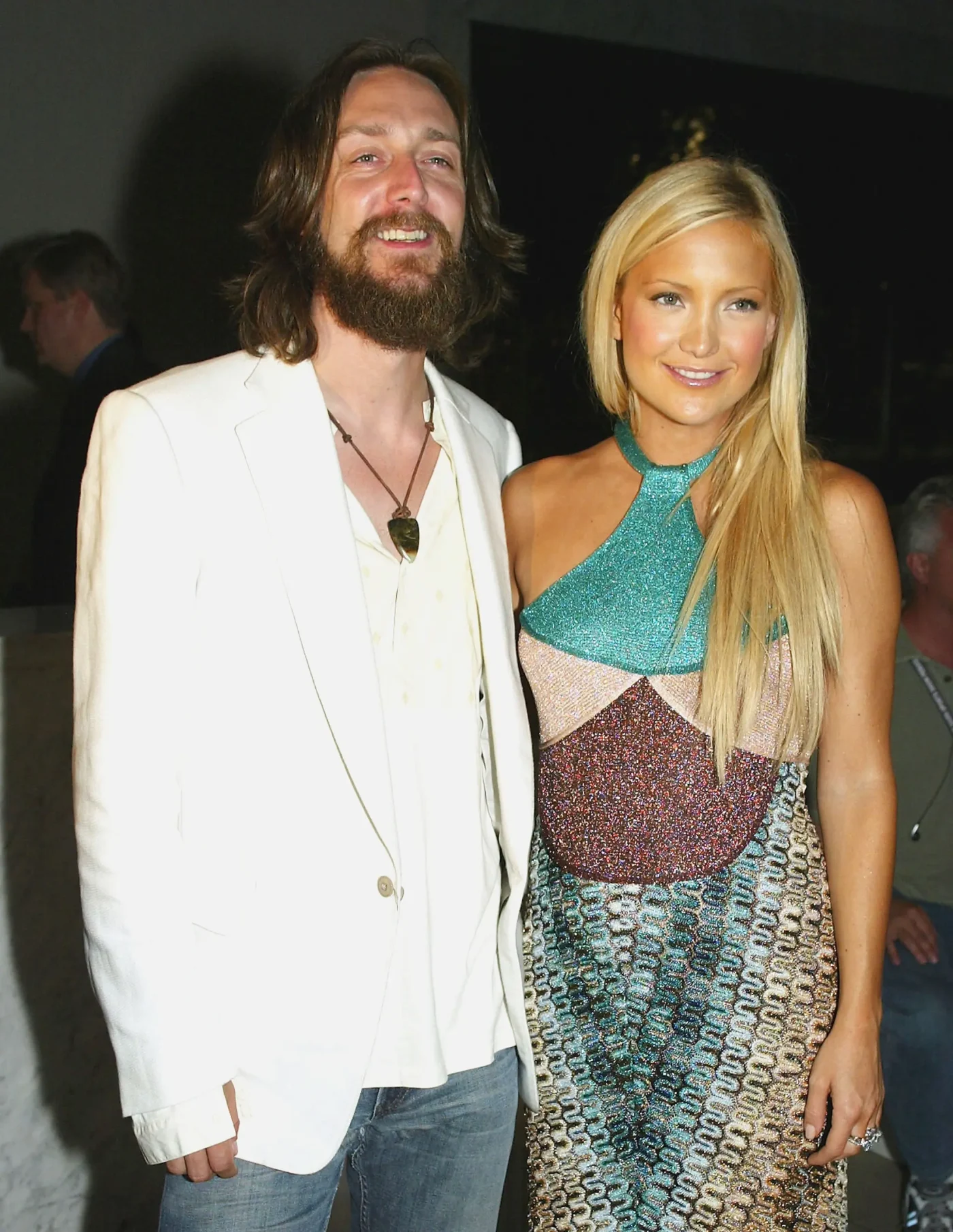 Kate Hudson and Chris Robinson standing together at an event.