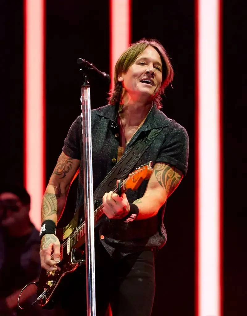 Keith Urban on stage with a guitar