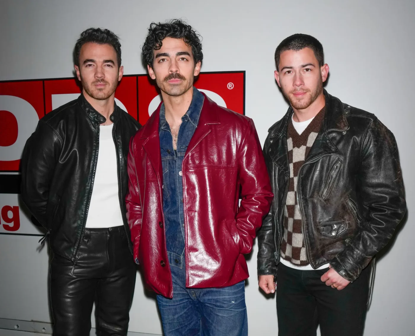 Kevin Jonas, Joe Jonas, and Nick Jonas stand together in New York City.