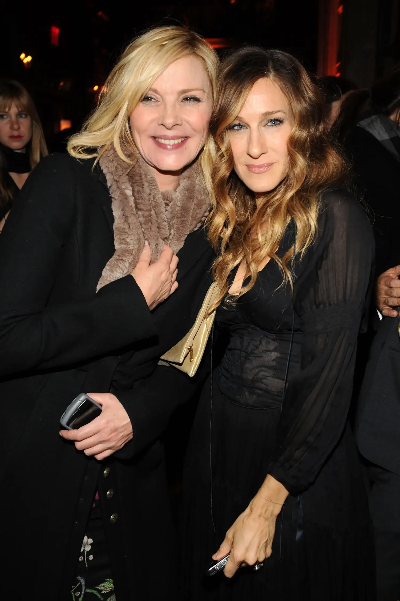 Kim Cattrall and Sarah Jessica Parker standing together