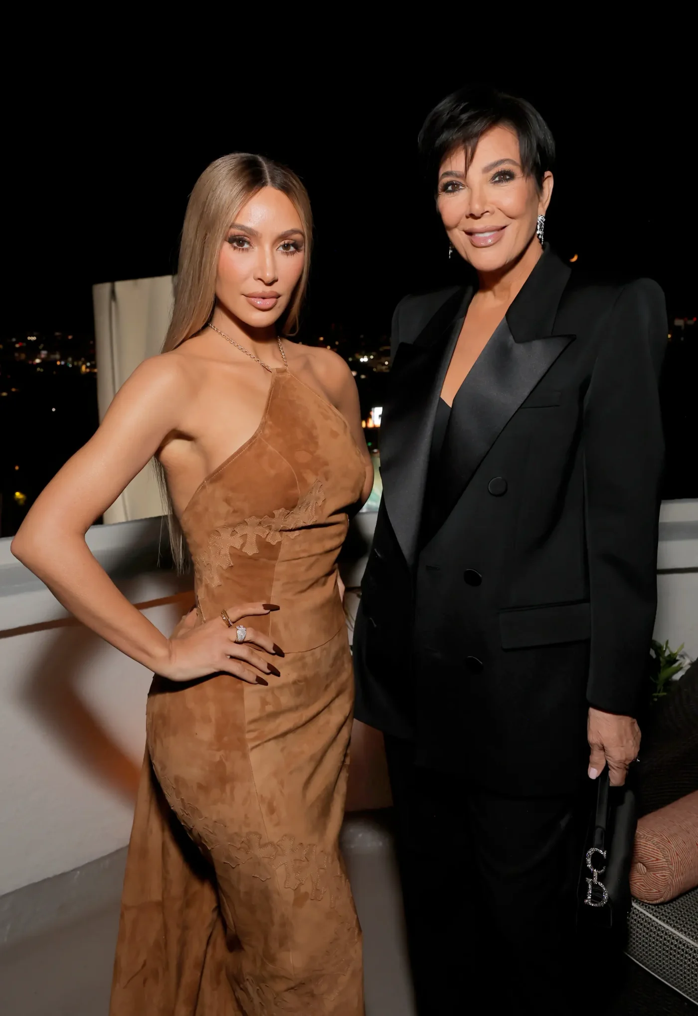 Kim Kardashian and Kris Jenner attend a dinner party.