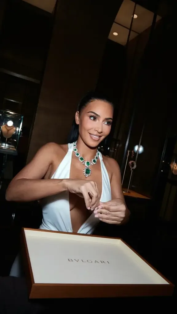 Kim Kardashian wearing Elizabeth Taylor's emerald necklace with white dress