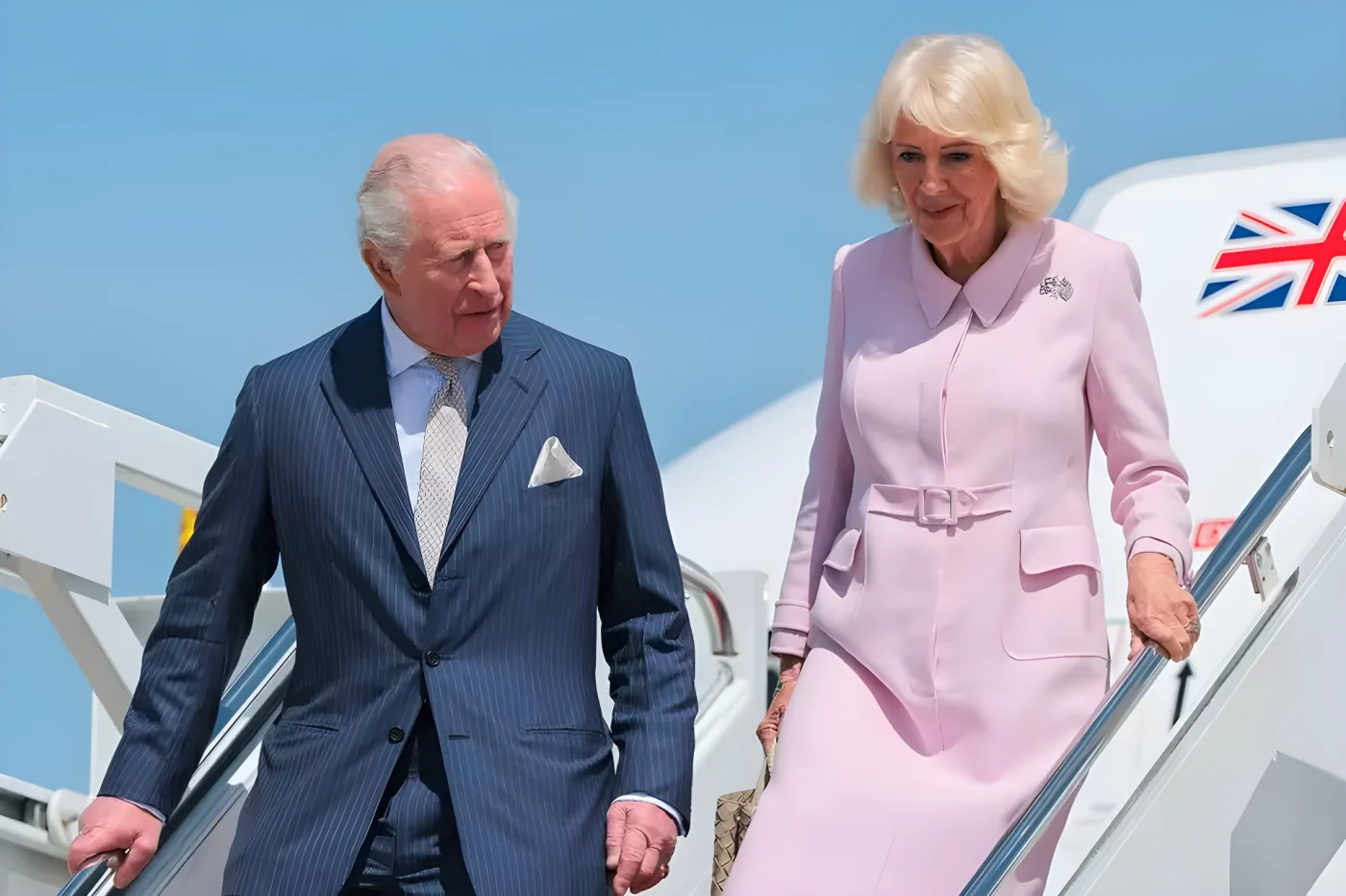 King Charles III and Queen Camila disembark their plane