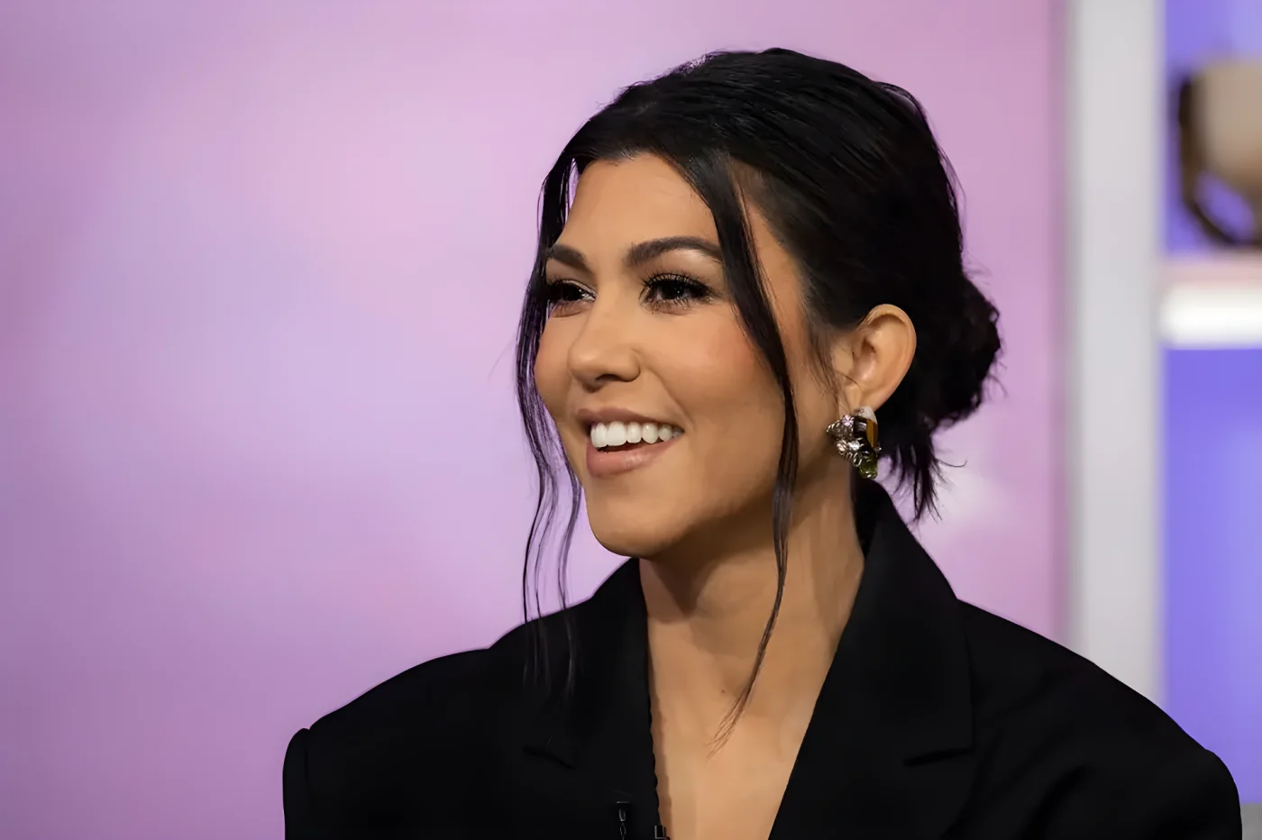 Kourtney Kardashian in black blazer