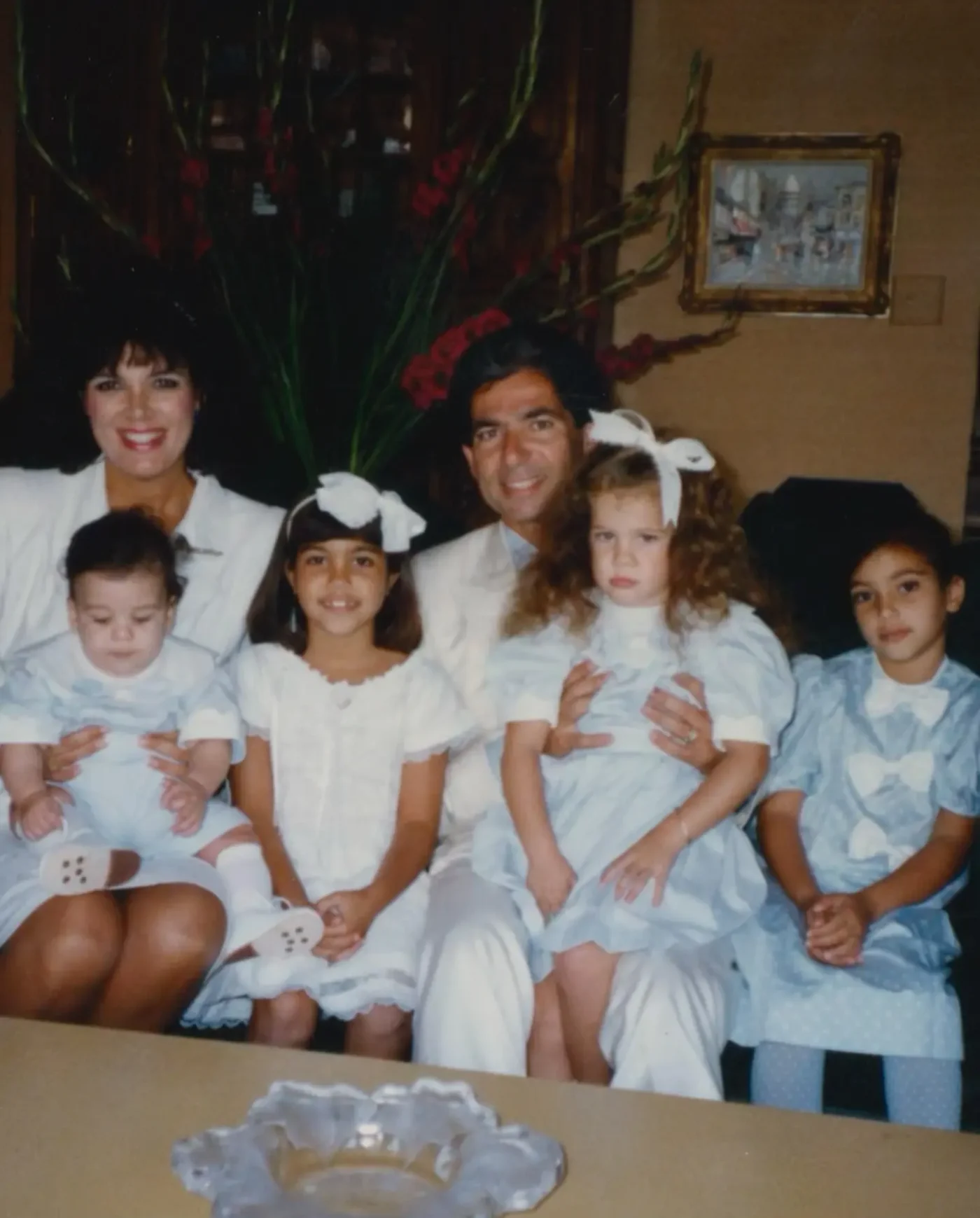 Kris Jenner and Robert Kardashian pose with their children, including Kourtney, Kim, Khloe, and Rob.