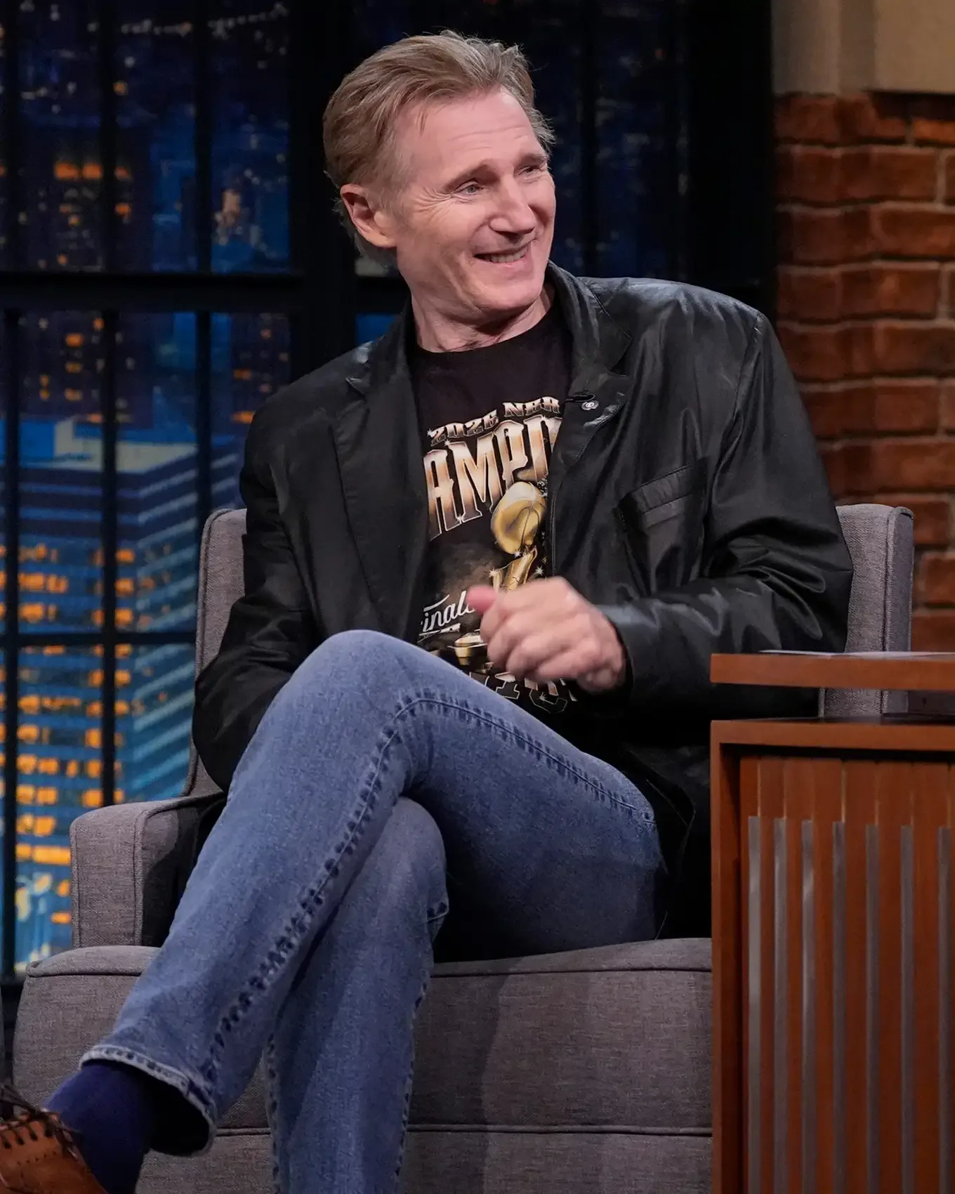 Liam Neeson during an interview with host Seth Meyers