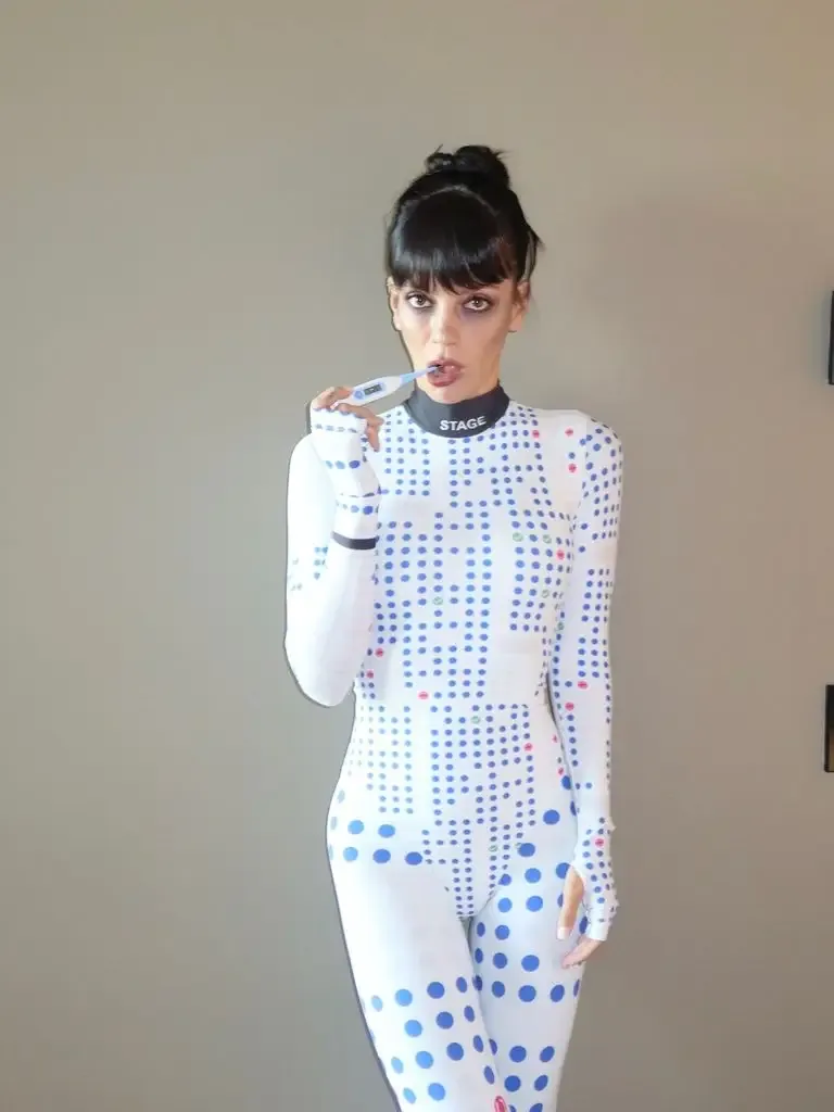 Lily Allen dressed as a Ticketmaster seat map covered in blue dots