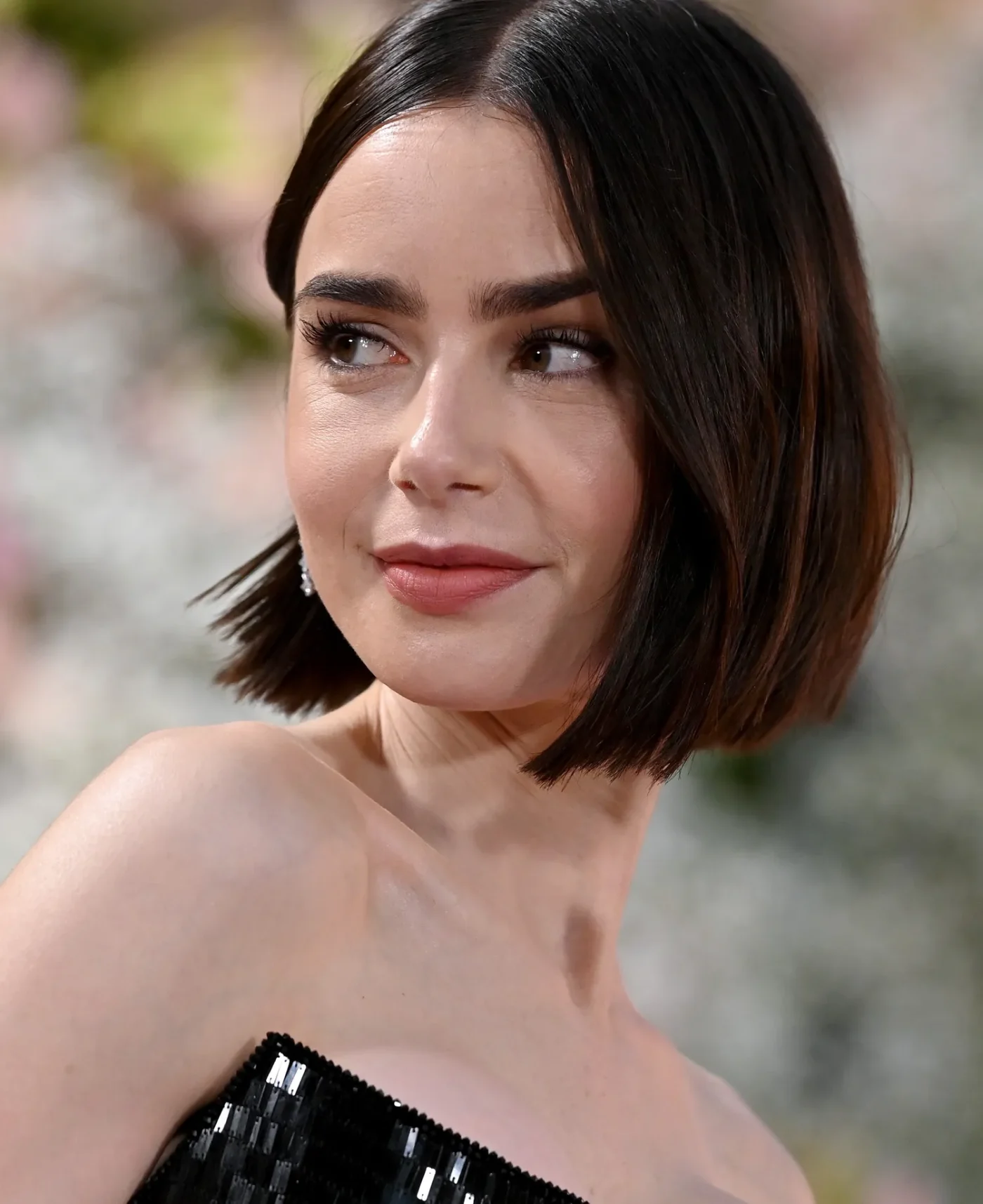 Lily Collins looking to the side