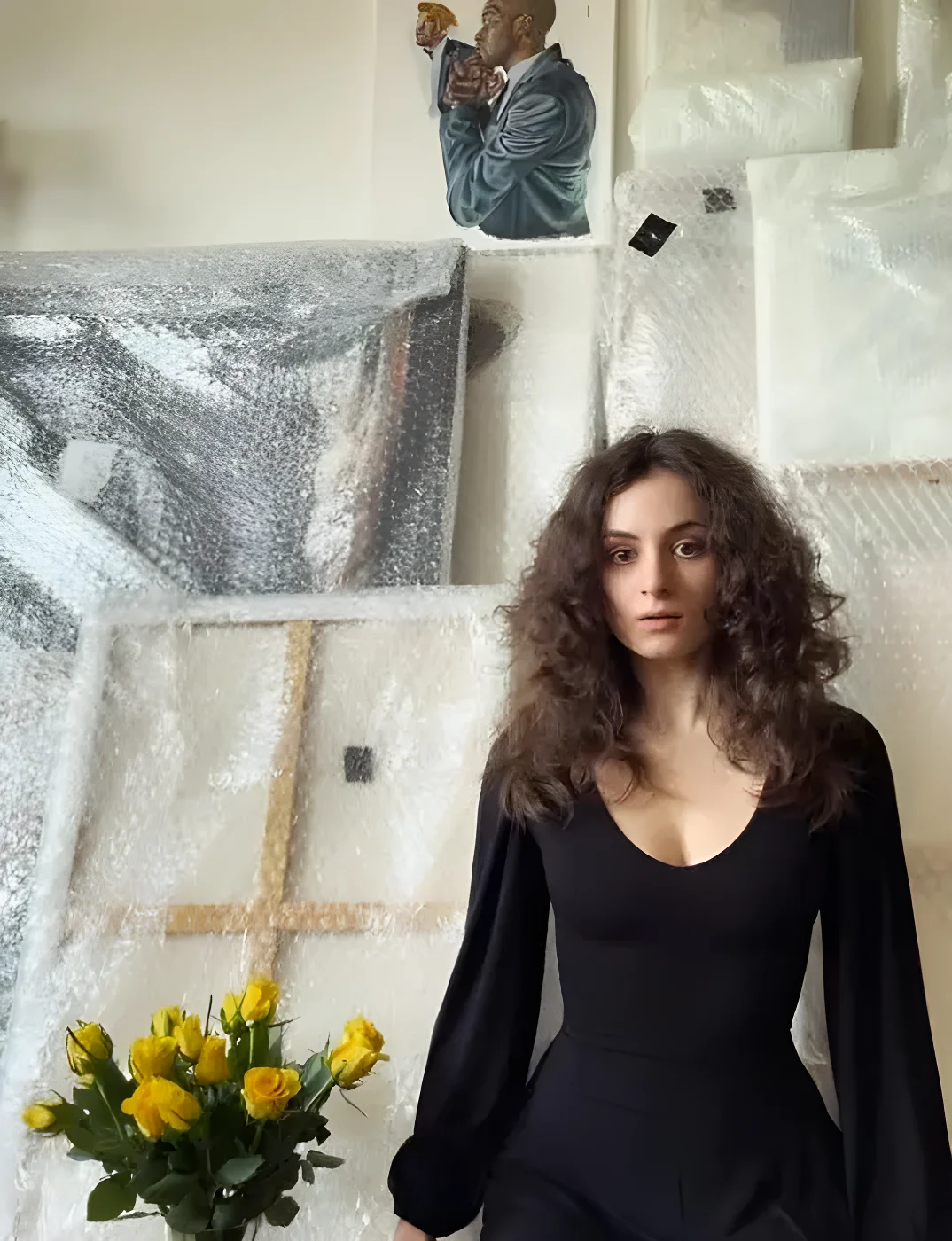 Lily Sastry surrounded by paintings