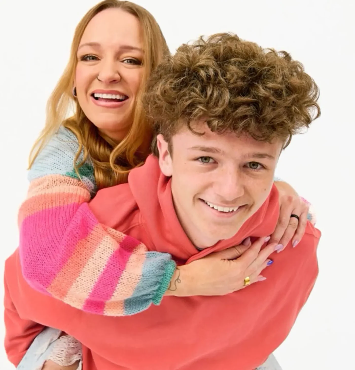 Maci Bookout giving her son Bentley a piggyback ride and smiling.