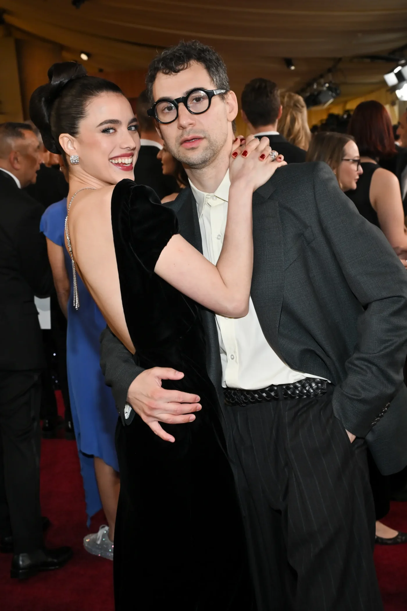 Margaret Qualley and Jack Antonoff pose for a photo at the 97th Oscars.