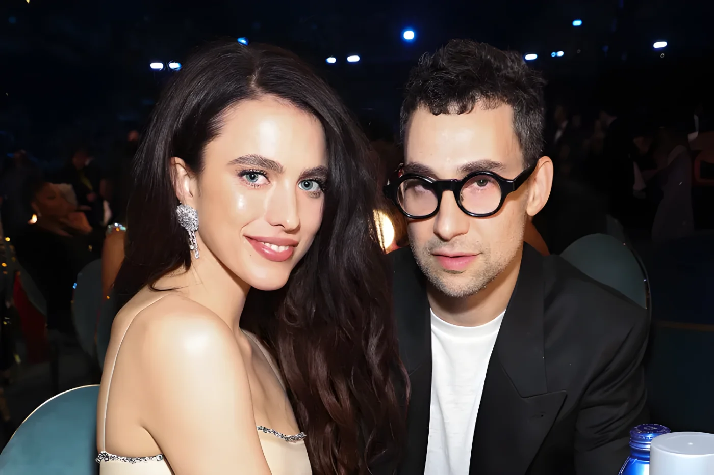 Margaret Qualley and Jack Antonoff sitting together