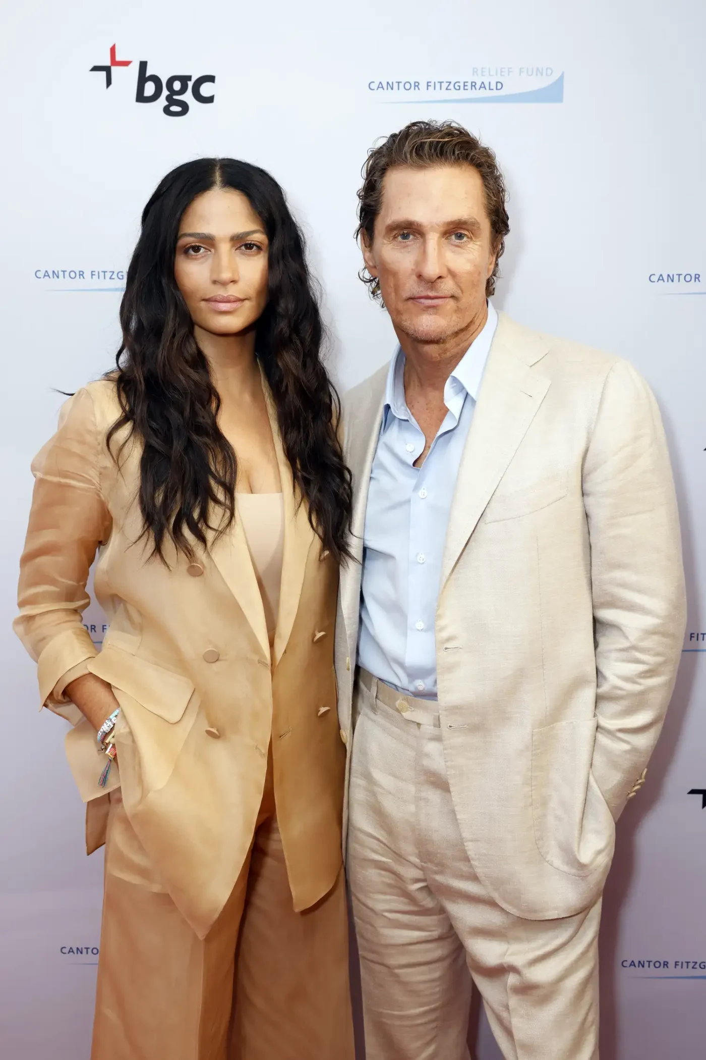 Matthew McConaughey and Camila Alves posing together at an event