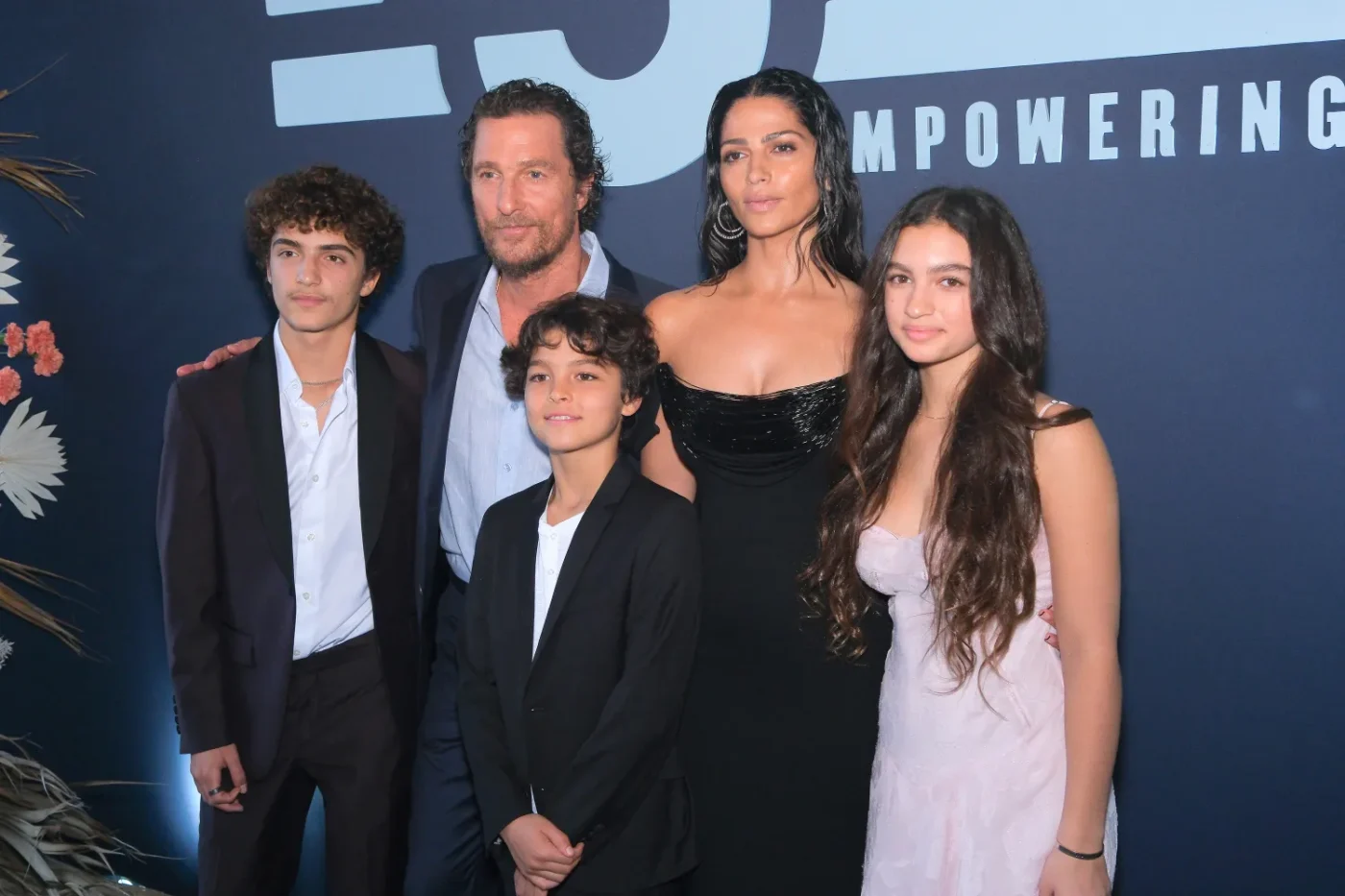 Matthew McConaughey and Camila Alves posing with their family at an event