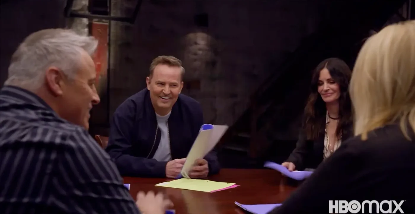 Matthew Perry and other cast members gathered around a table with scripts during the Friends reunion.