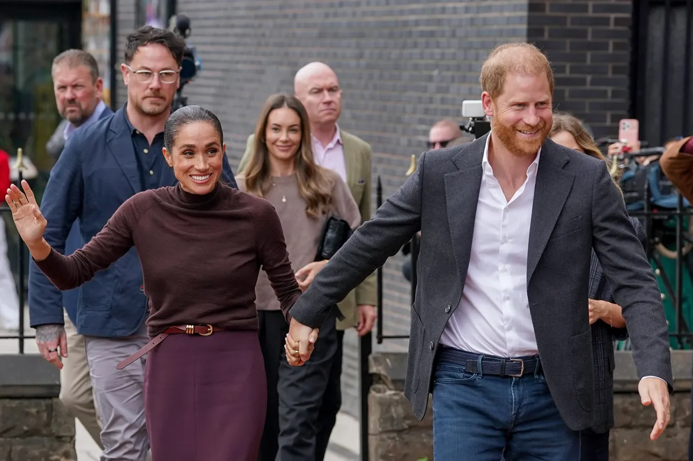Meghan, Duchess of Sussex, and Prince Harry, Duke of Sussex, arrive at Himmah Hub, a food poverty community action group, during the Duke and Duchess of Sussex