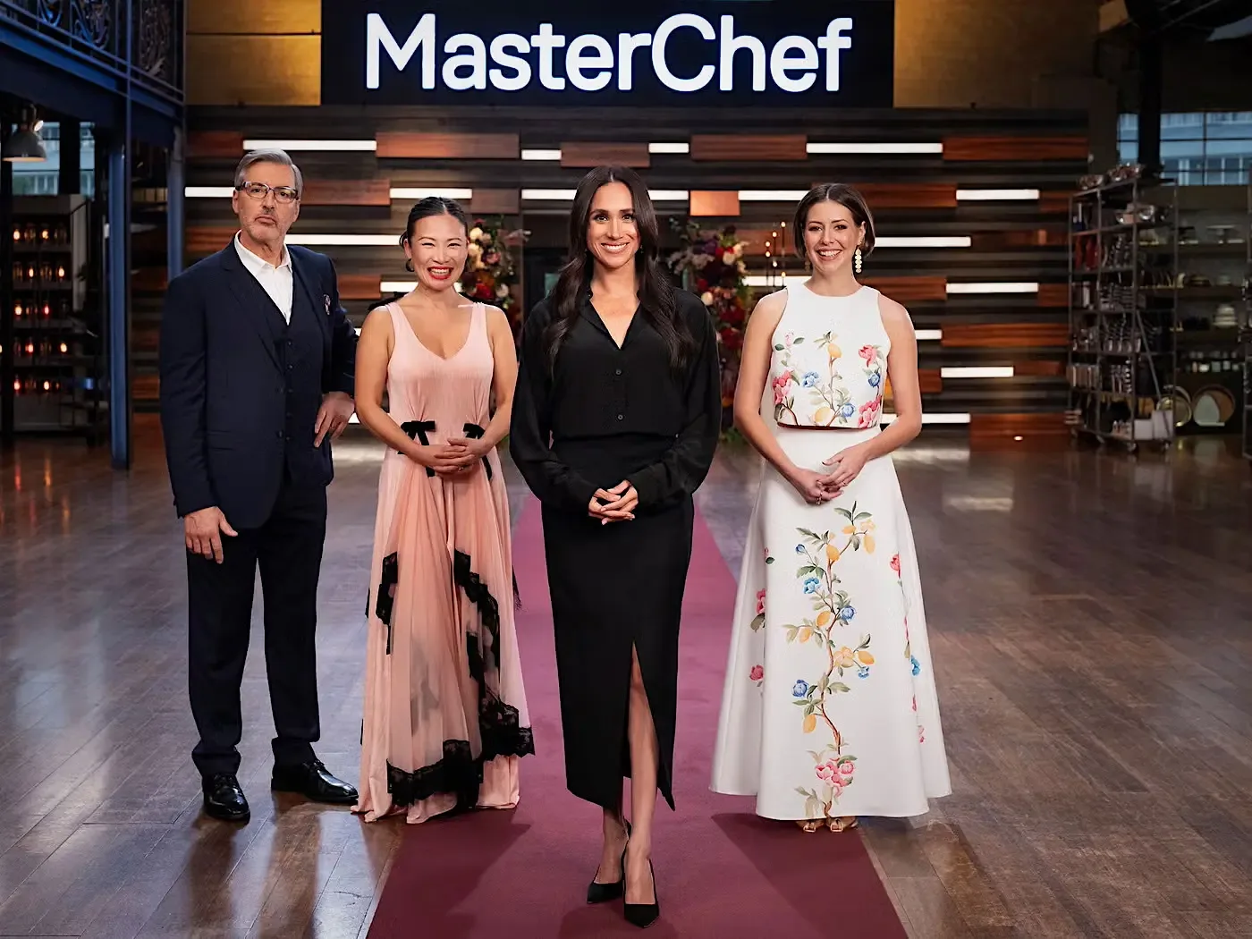 Meghan Markle, Poh Ling Yeow, and judges standing on the MasterChef Australia set.