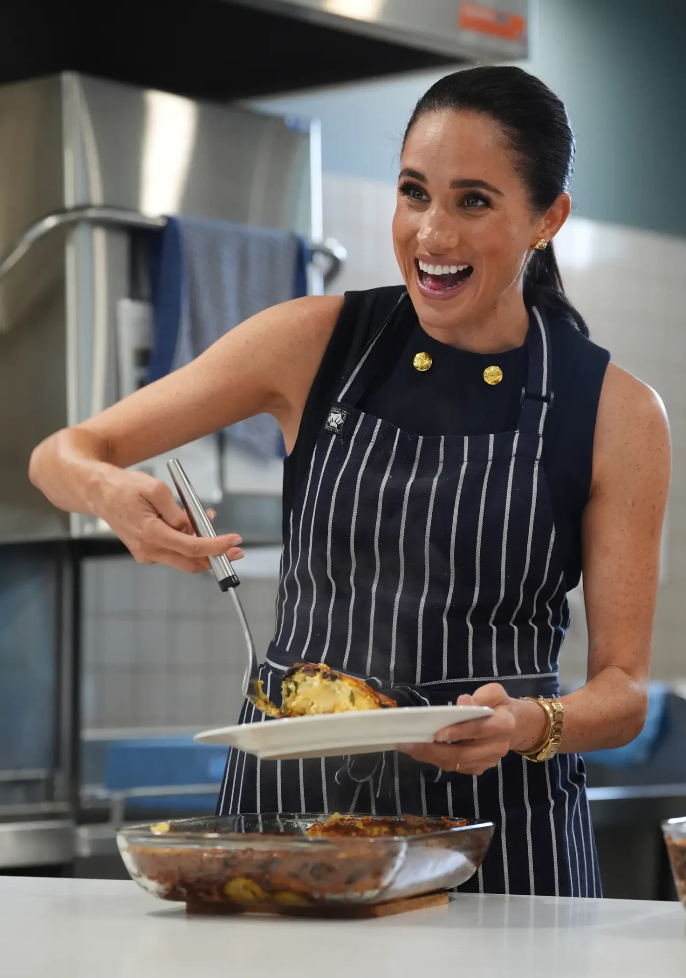Meghan Markle serves lunch at a women