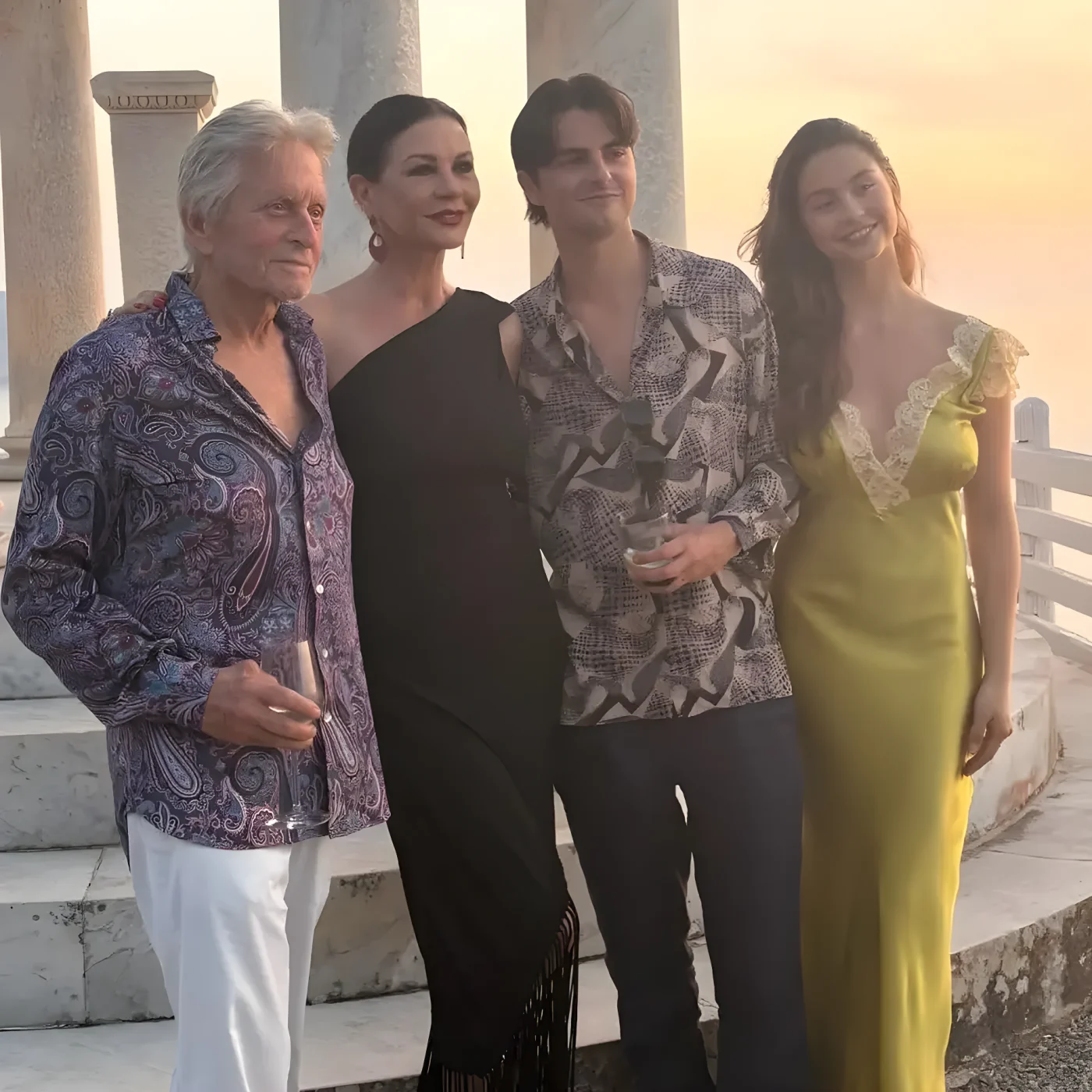 Michael Douglas and Catherine pose with two kids on vacation