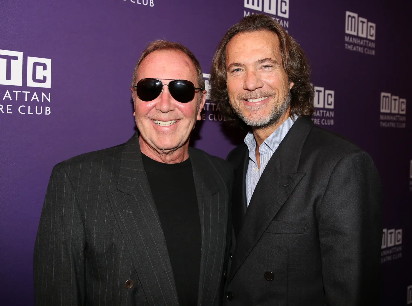 Michael Kors and Lance LePere standing together at an event.