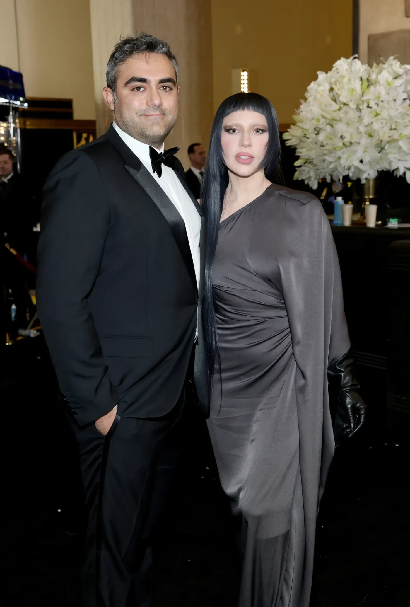 Michael Polansky and Lady Gaga posing at an event