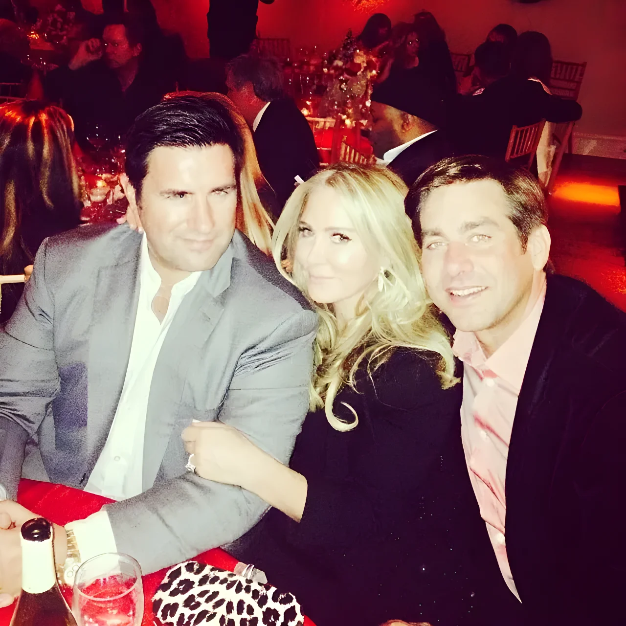 Monet Berger and Jason Galanis seated together at a table.