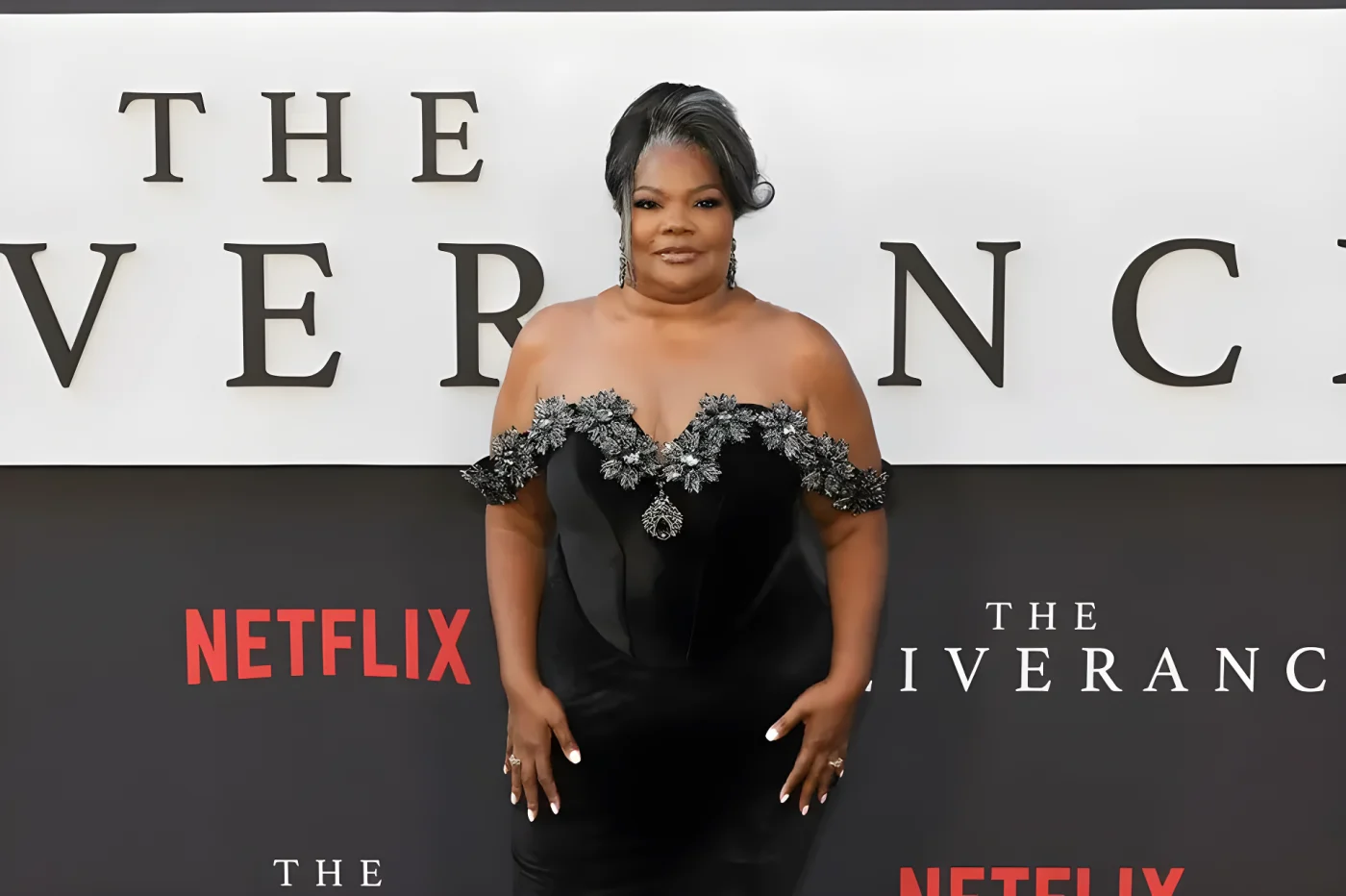 Mo'Nique poses in an off-the-shoulder black gown with crystal embellishments at the premiere of "The Deliverance".