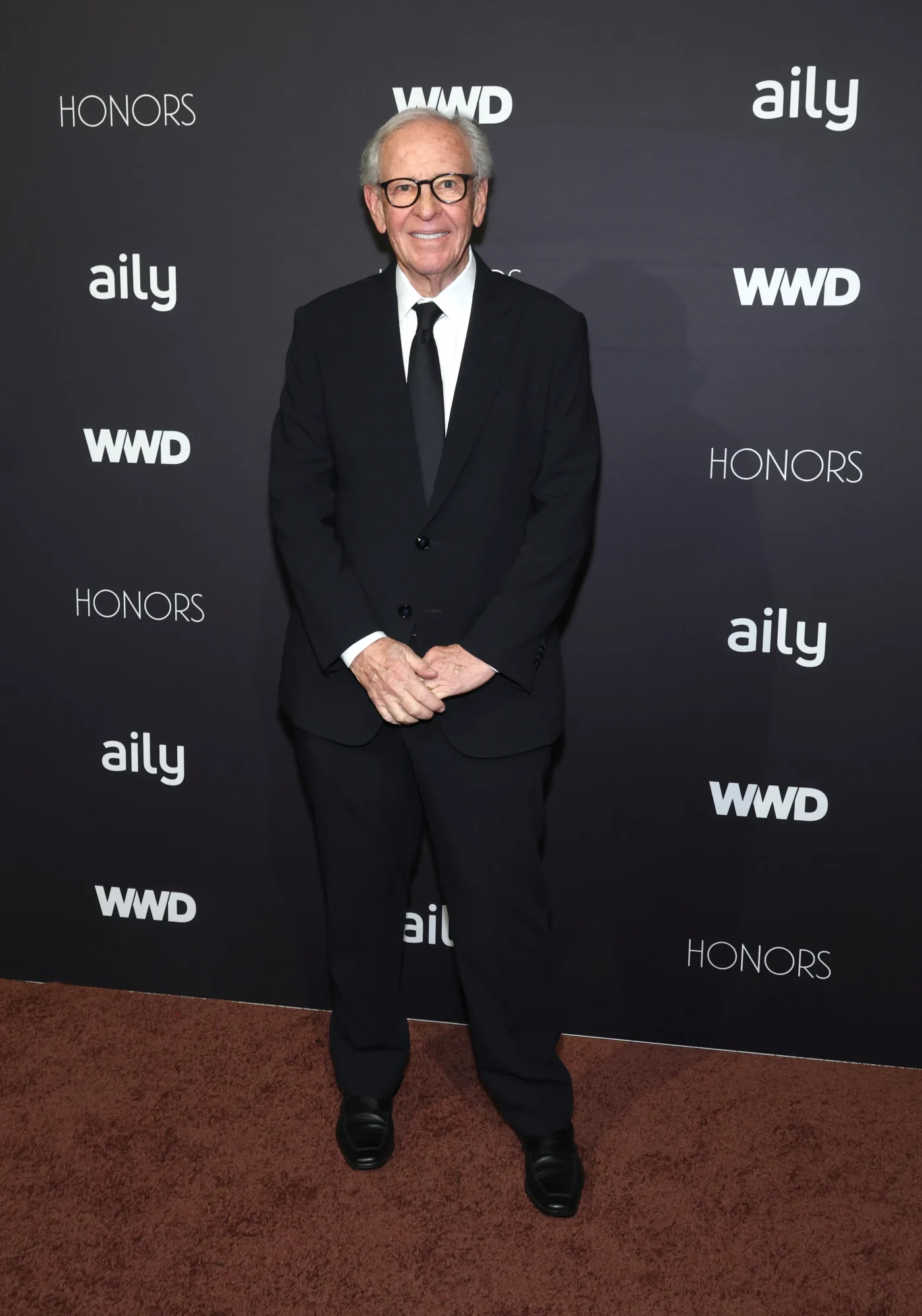 Morris Goldfarb on a step-and-repeat backdrop at the WWD Honors.