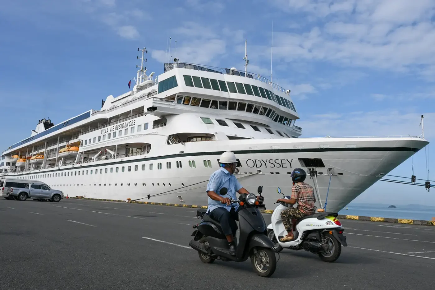 Motorists riding past the Villa Vie Residences