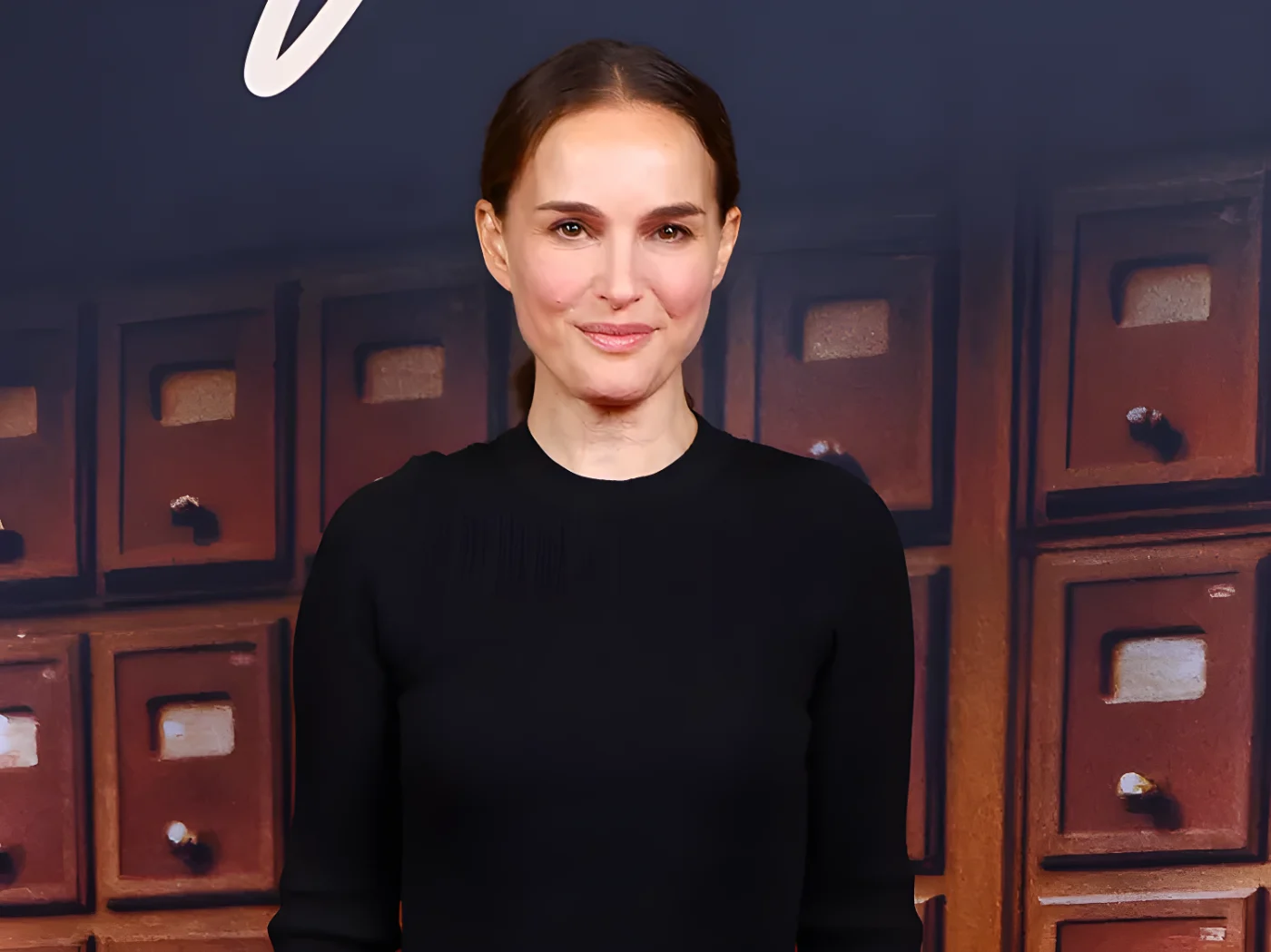 Natalie Portman smiling in black